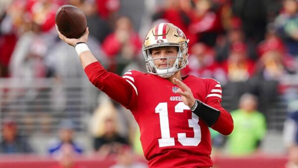 Quarterback Brock Purdy throwing the ball