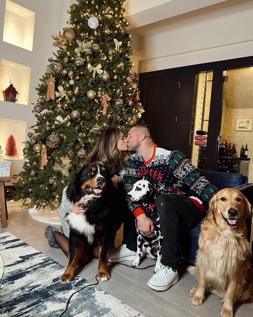 Tim Tebow and his wife Demi-Leigh Tebow with their dogs