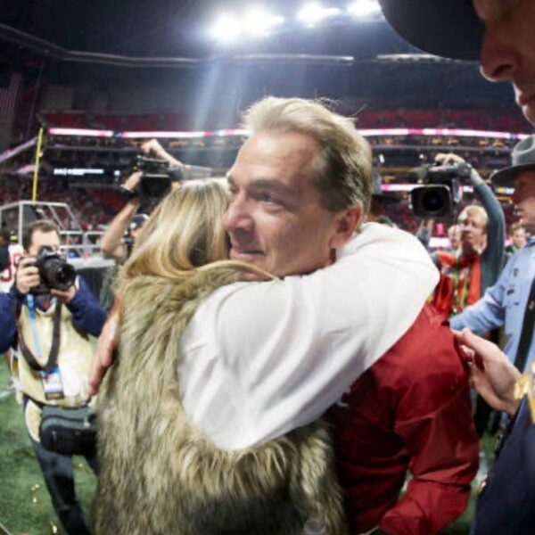 Head coach Nick Saban hugging his daughter
