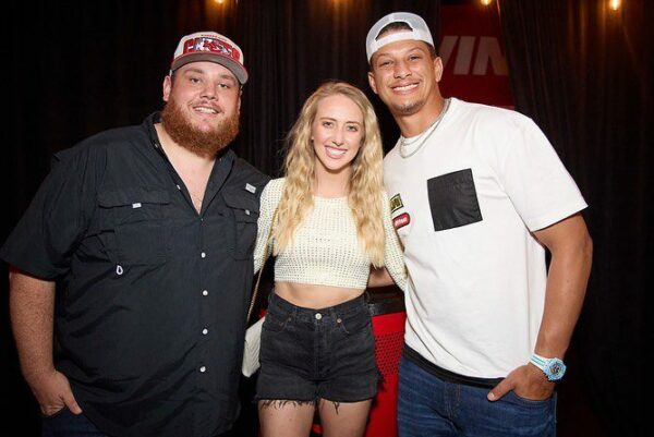 Patrick Mahomes with his wife and Luke Combs