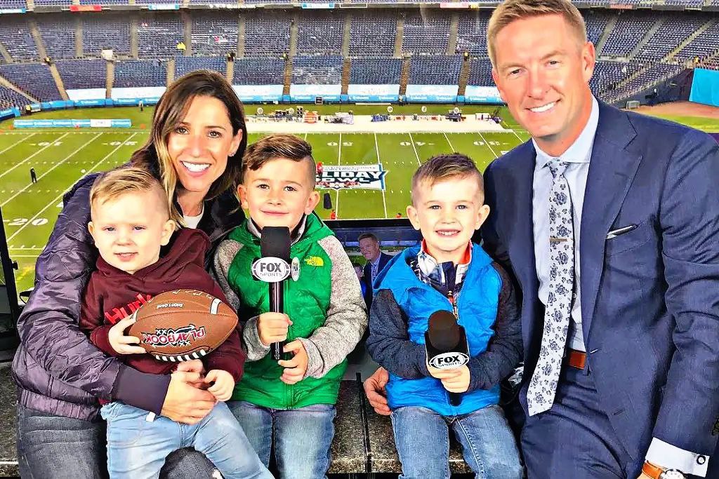 Sara Ordway and joel klatt and their children inn NFL stadium