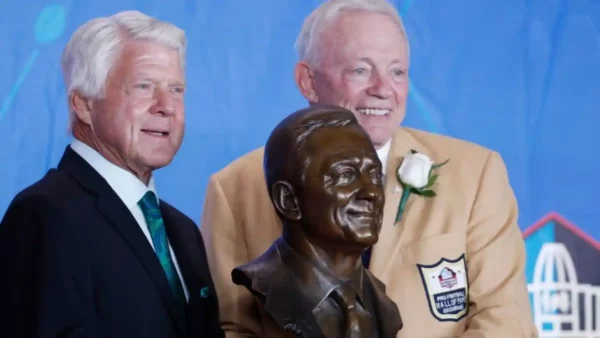 Jerry Jones and Jimmy Johnson posing for photo