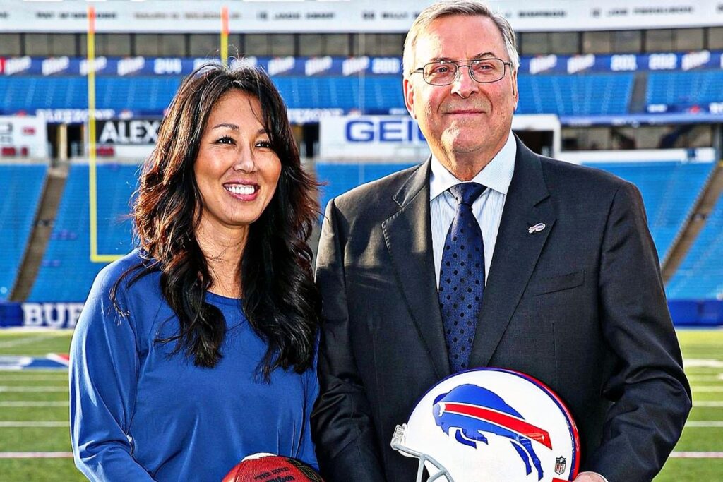 terry pegula and kim pegula in nfl field