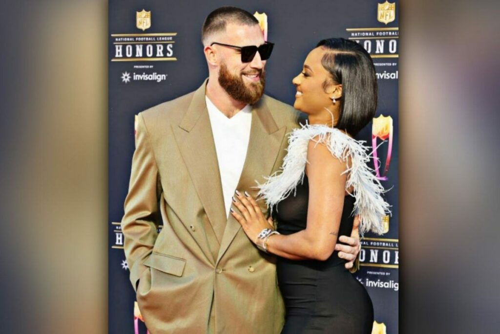 Travis Kelce and kayla nicole looking at each other