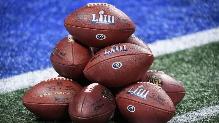 A bunch of Nfl balls