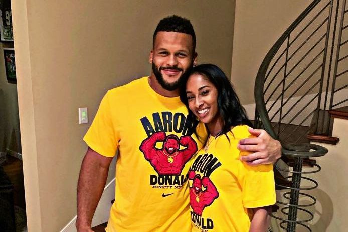 Erica Doland and aaron Doland wearing yellow Tshirts