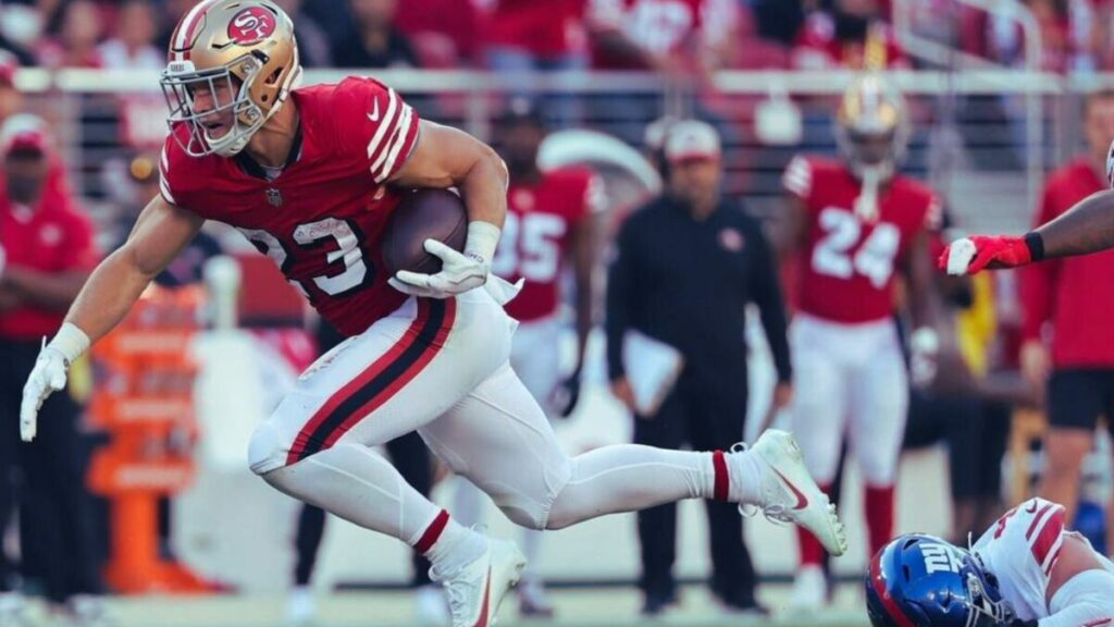 Christian McCaffrey running during a match