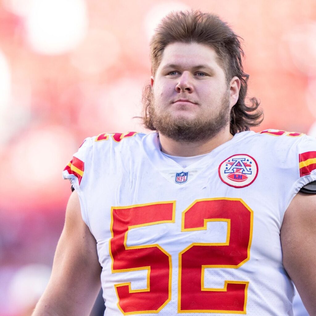 Kansas chiefs player Creed Humphrey is standing on the field.